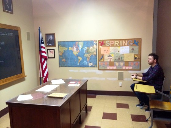 Written on the chalkboard: "duck and cover"